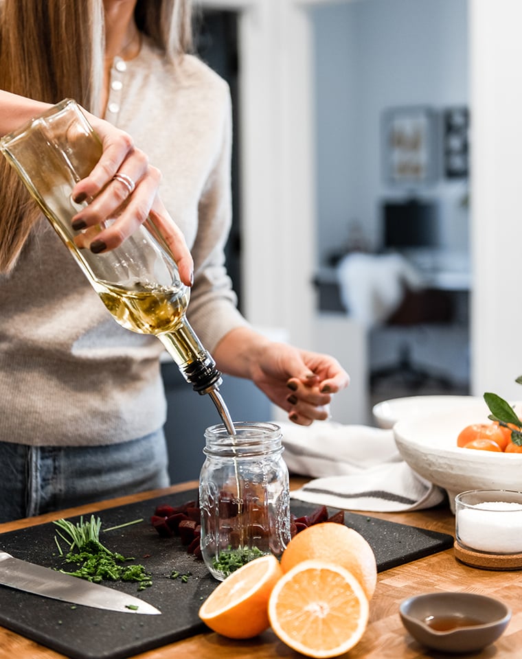 Lindsay pouring olive oil