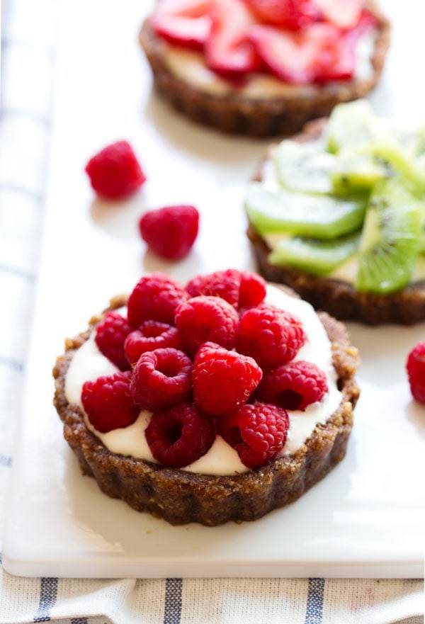 Fruit pizza with raspberries.