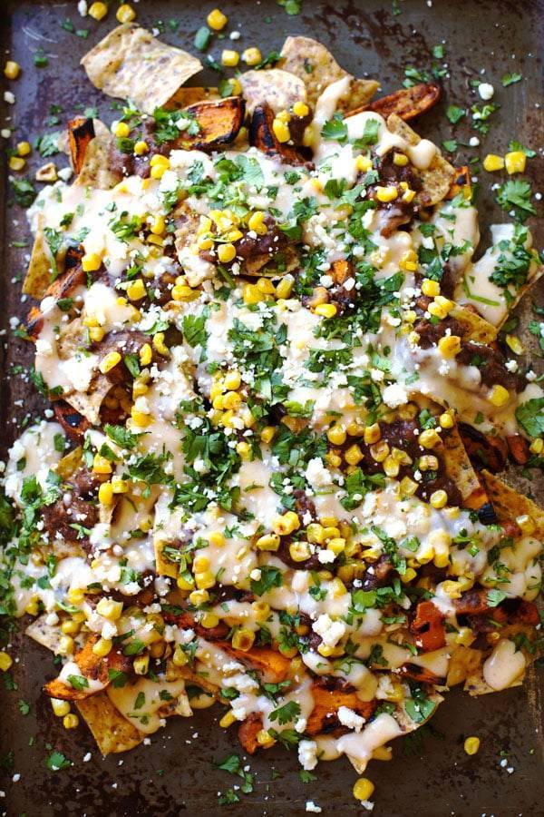 Nachos on a black surface.