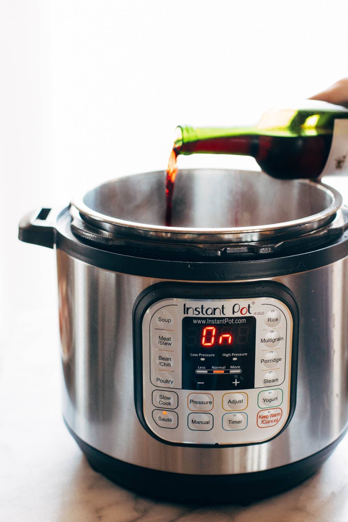 Wine poured into an Instant Pot.