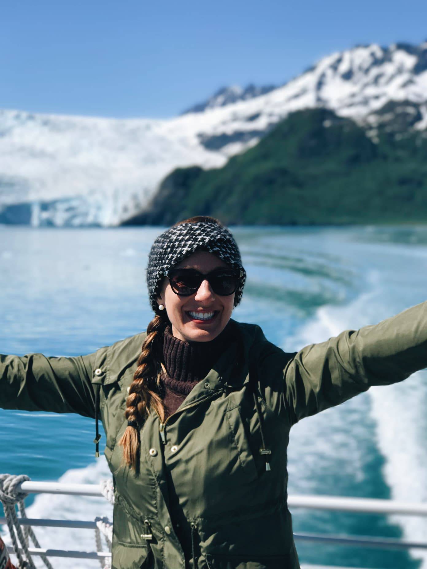 Woman wearing sunglasses on a boat.