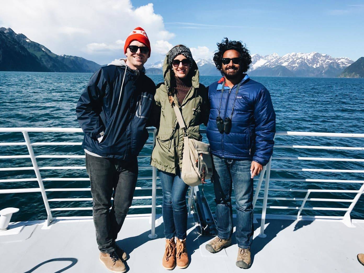 Two men and a woman on a boat.