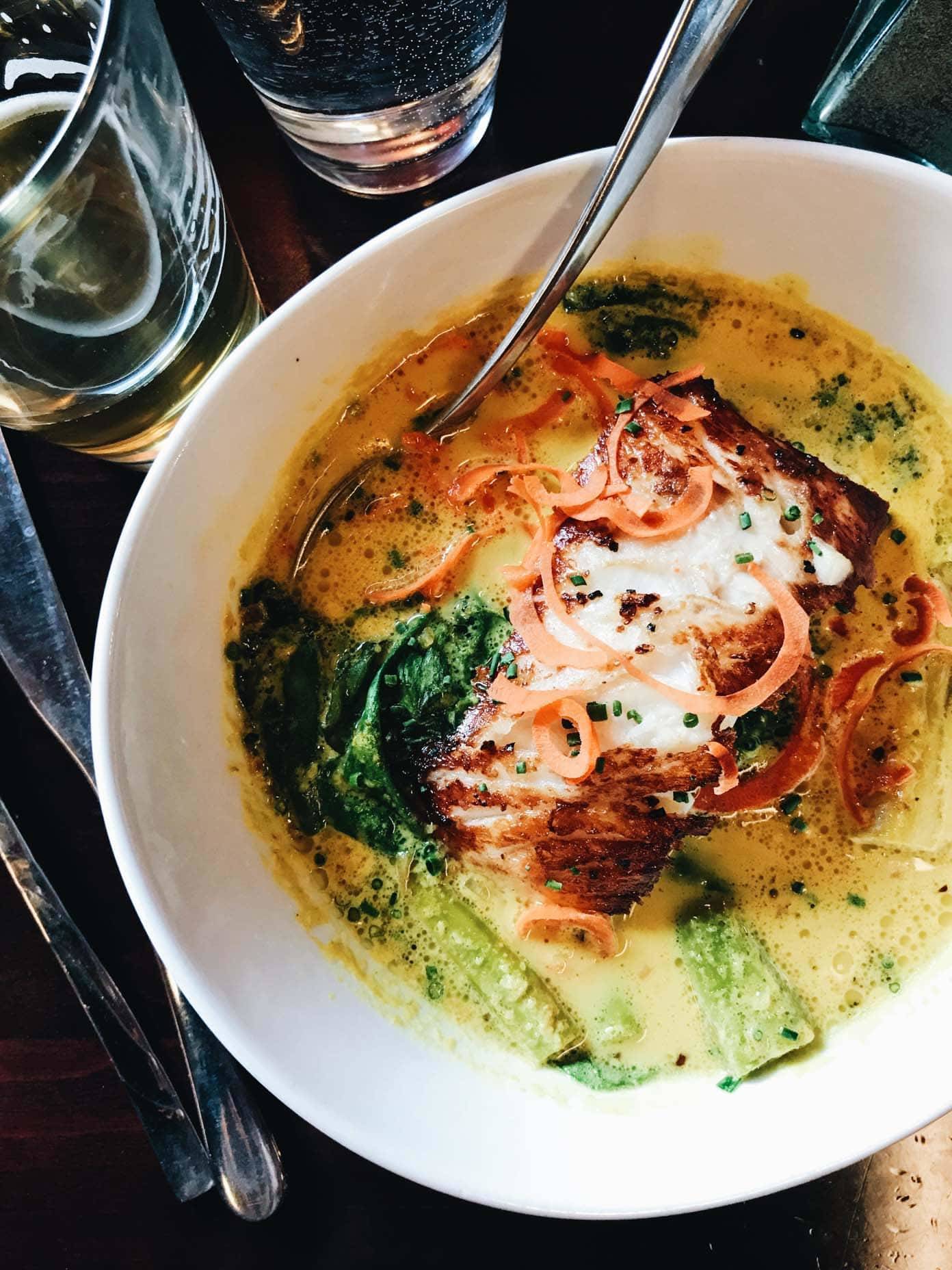 Bowl of food with a spoon.