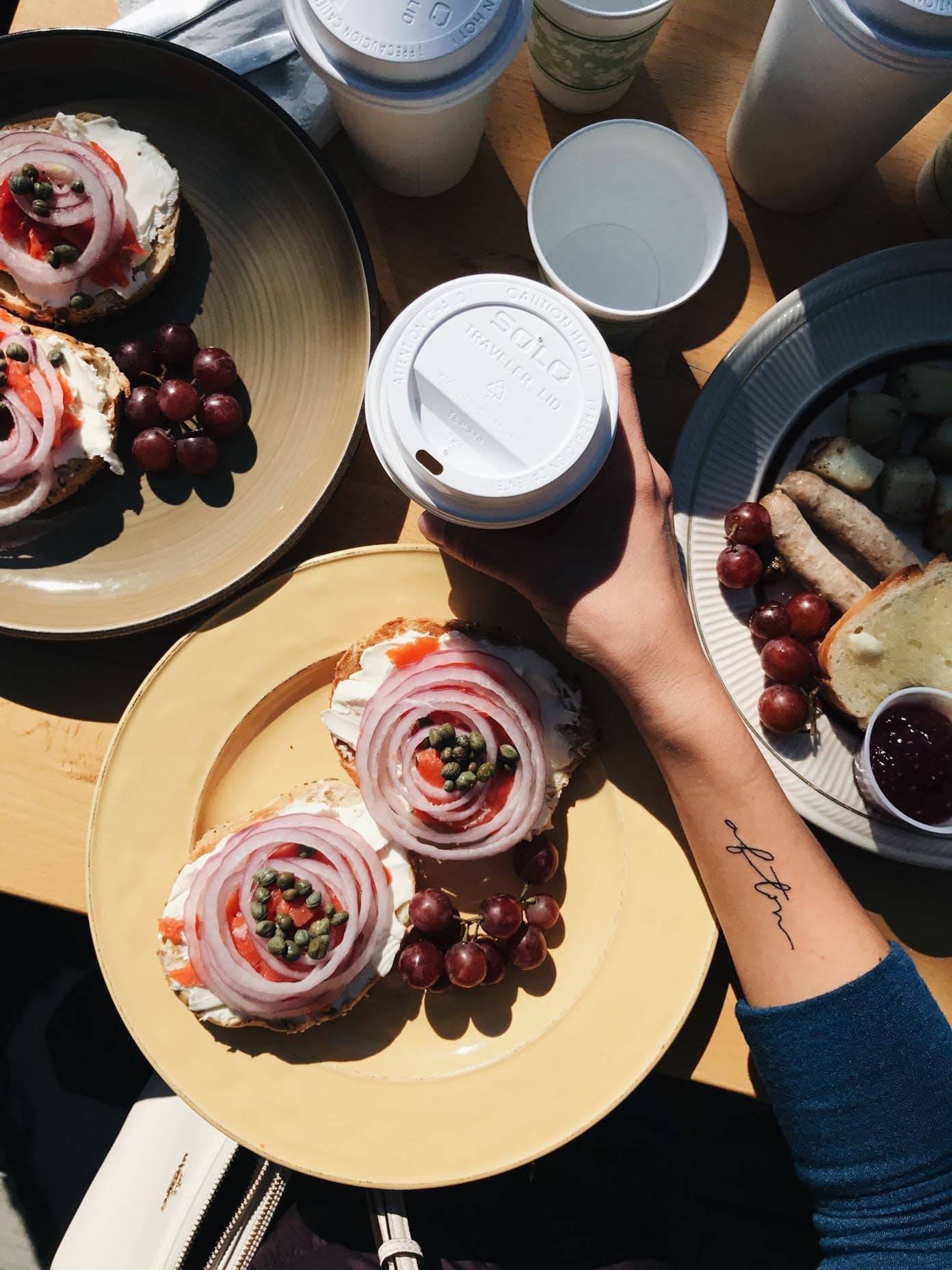 Arm reaching for a coffee cup.