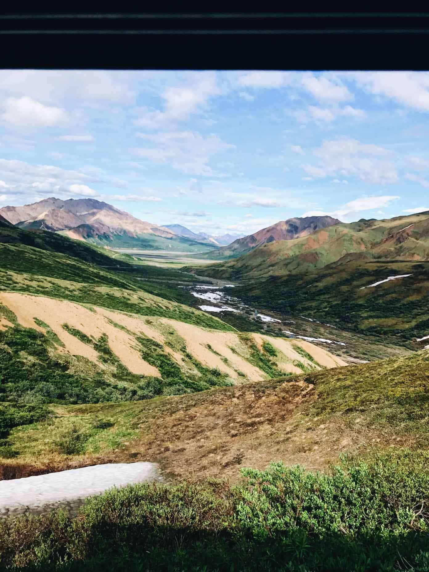 Mountains and grassy hills.