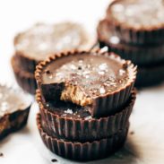 Stack of three almond butter cups.