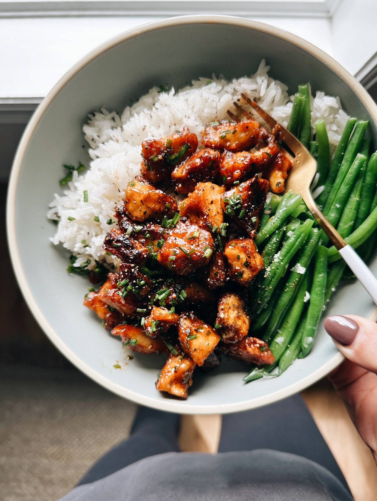 Sesame apricot tofu in a bowl with green beans.