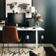 Desk against a dark painted wall.