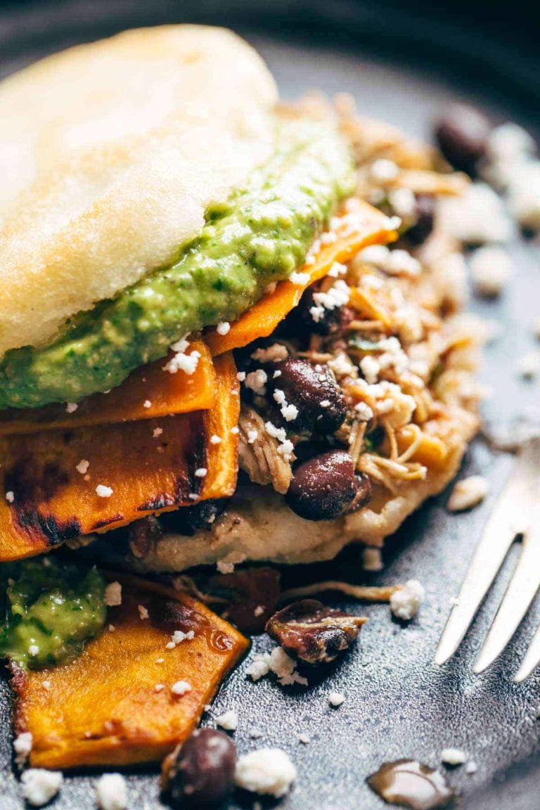 Arepas on a plate with a fork.