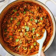 Arroz Con Pollo in a bowl with a spoon in it.