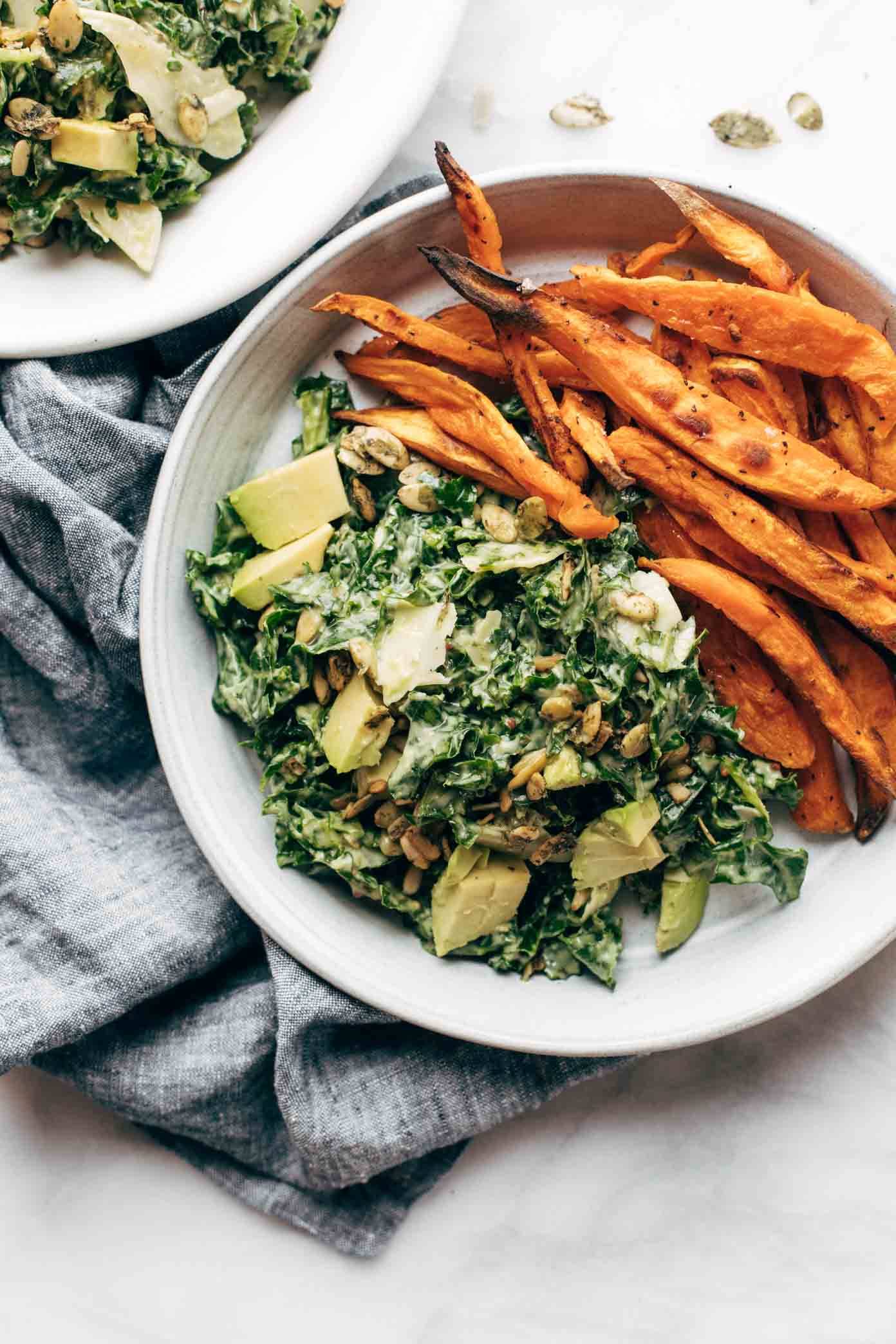 Avocado caesar salad with sweet potato fries.