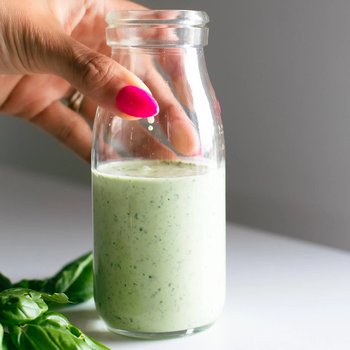 Basil sauce in a jar.