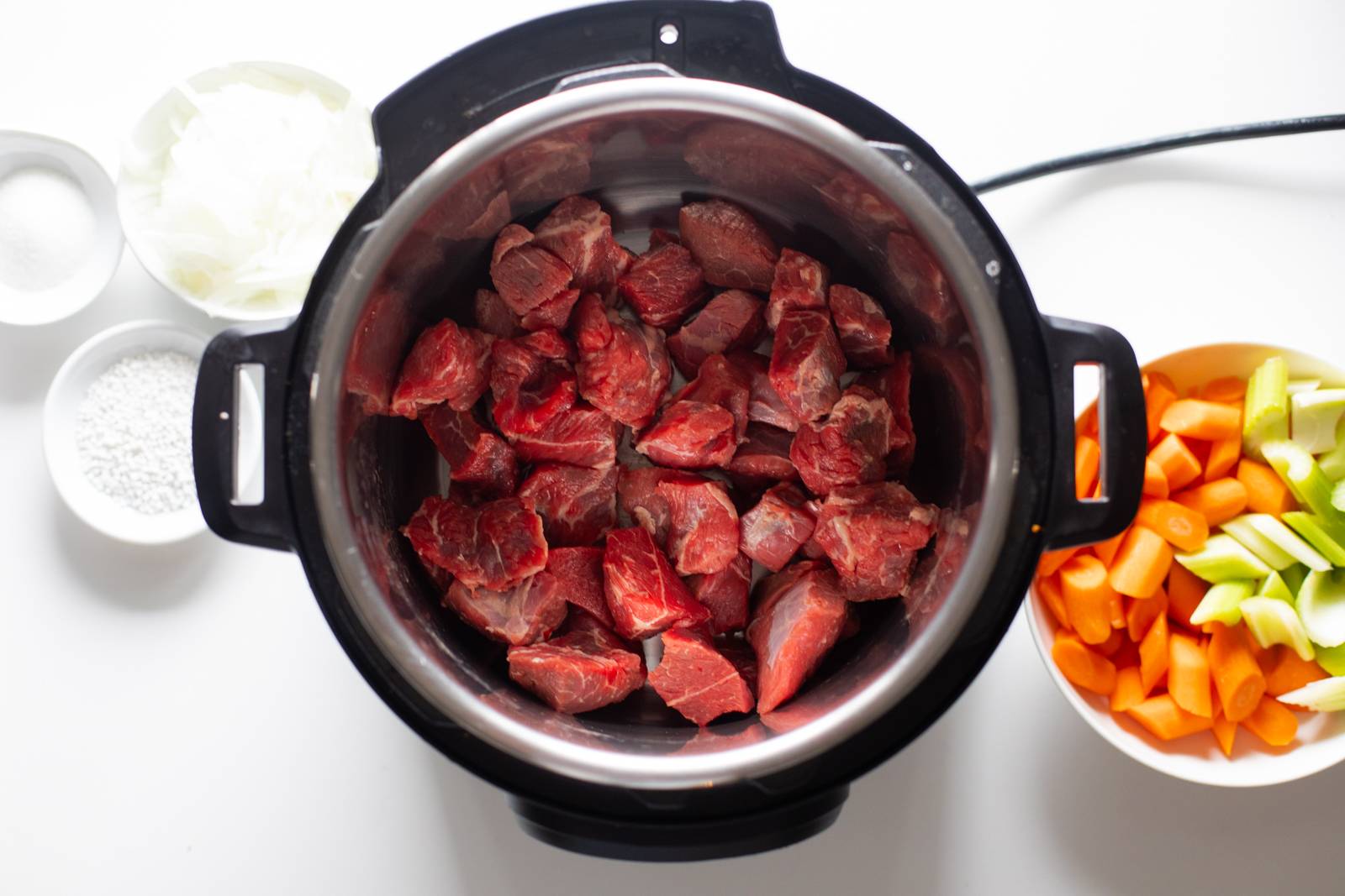 Beef in chunks in an Instant Pot.