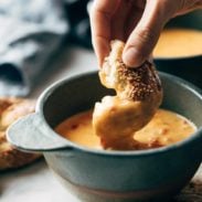 Beer Cheese Soup with pretzel dipping in.