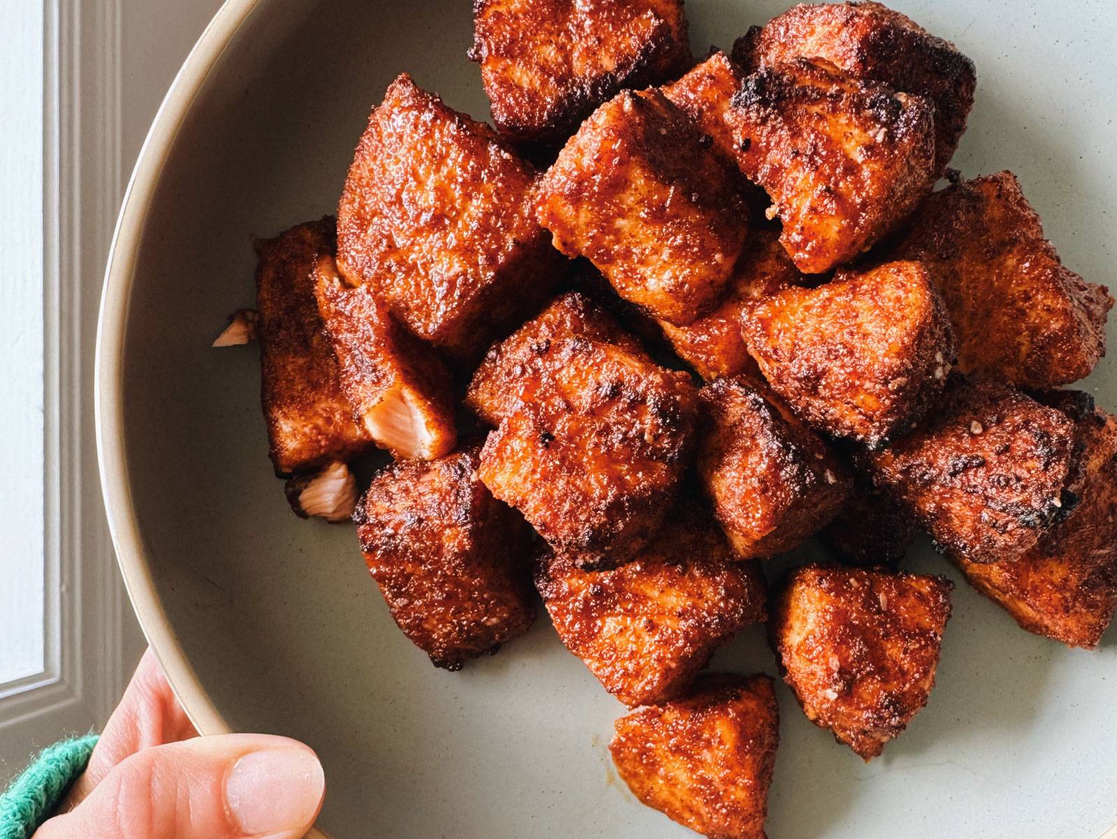 Cooked air fryer salmon on a plate.