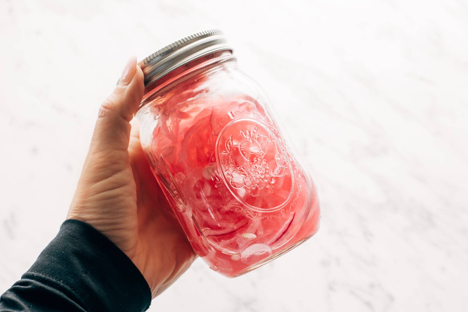 Pickled onions in a jar.