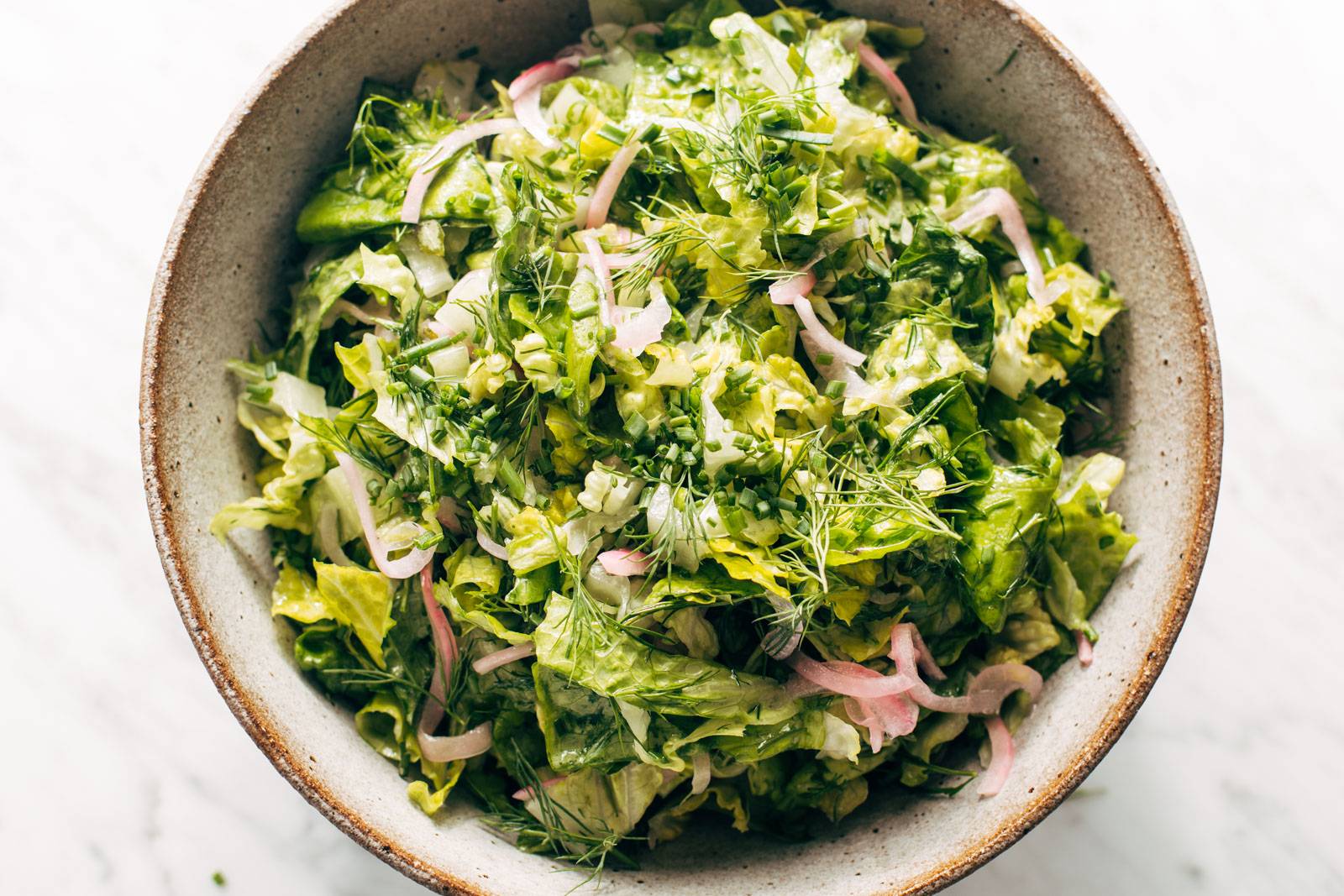 Finished bistro salad in a bowl.