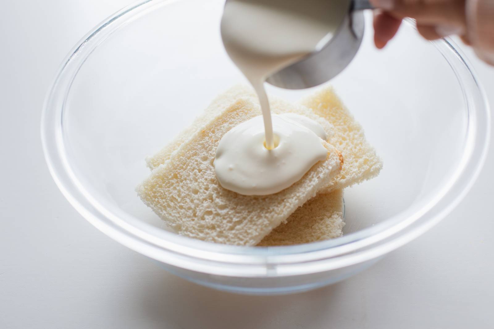 Soaking bread in cream.