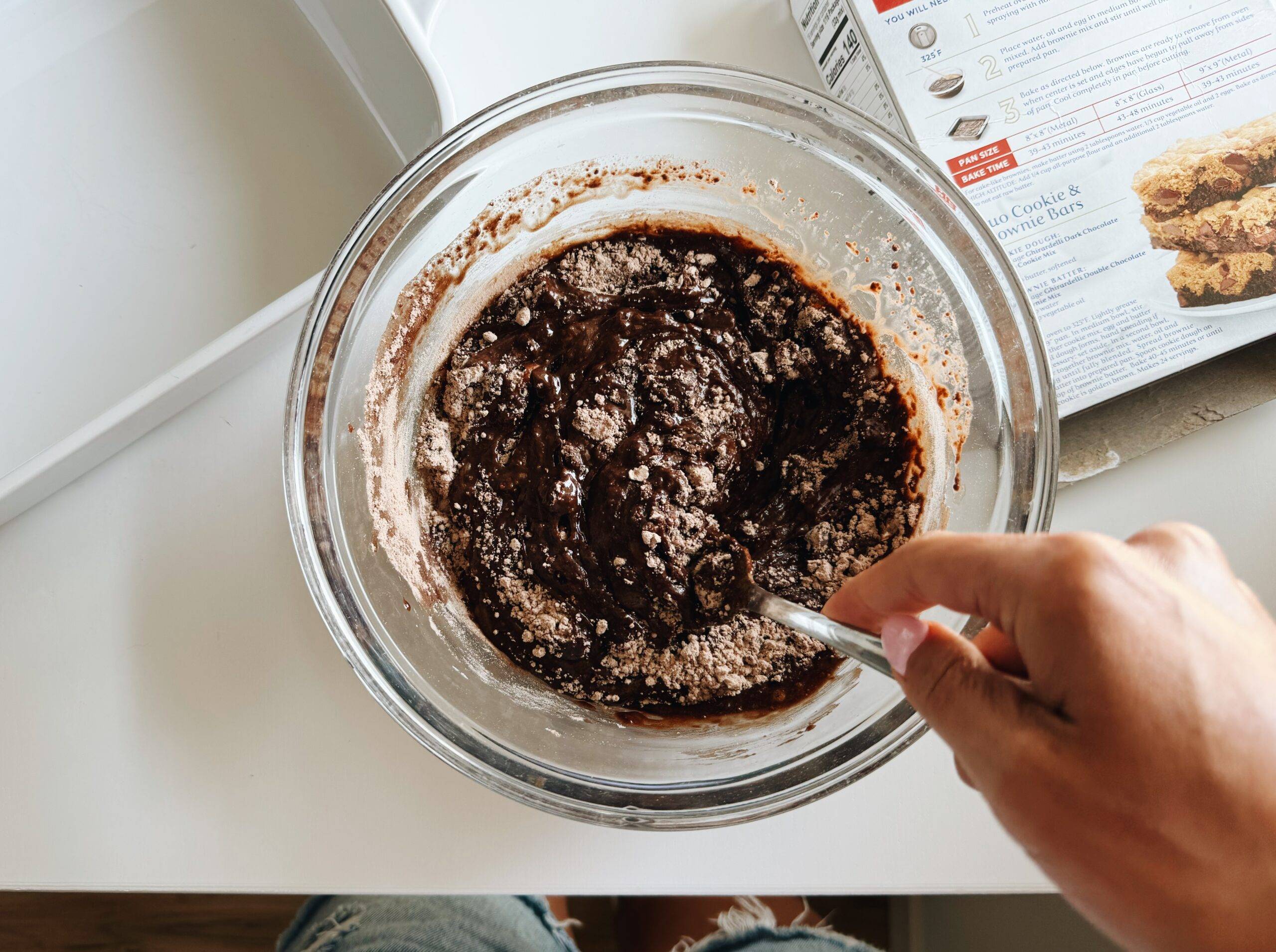 Mixing brownie mix in a bowl.