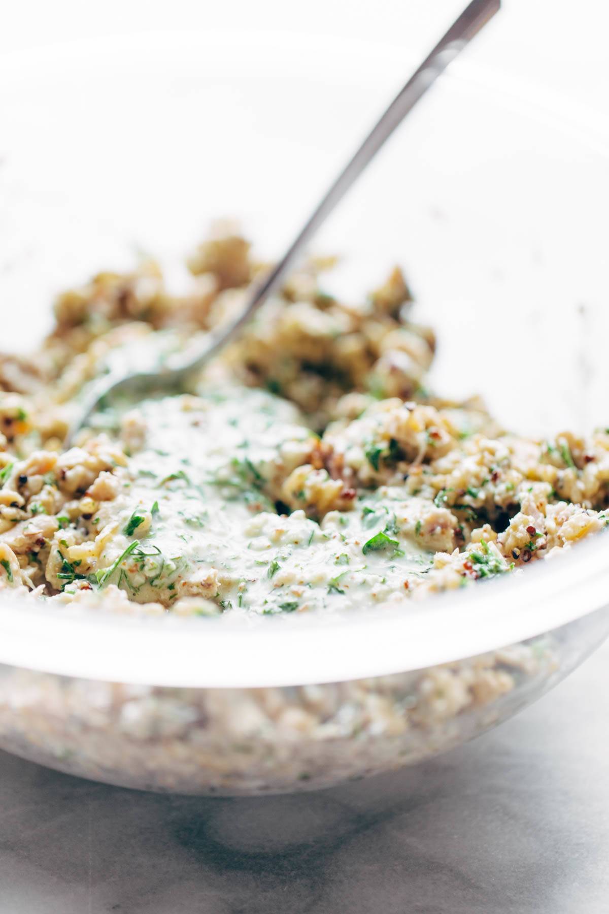 Chicken salad in a bowl with a spoon.