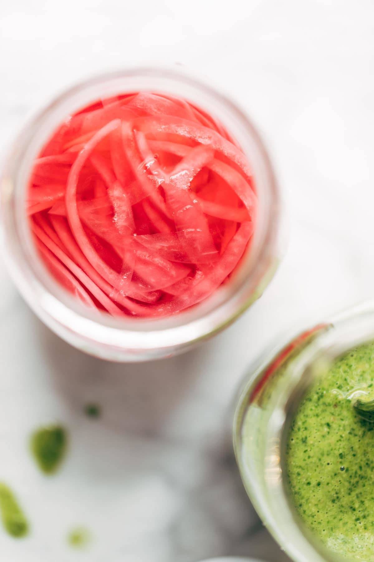 Pickled red onions in jar.