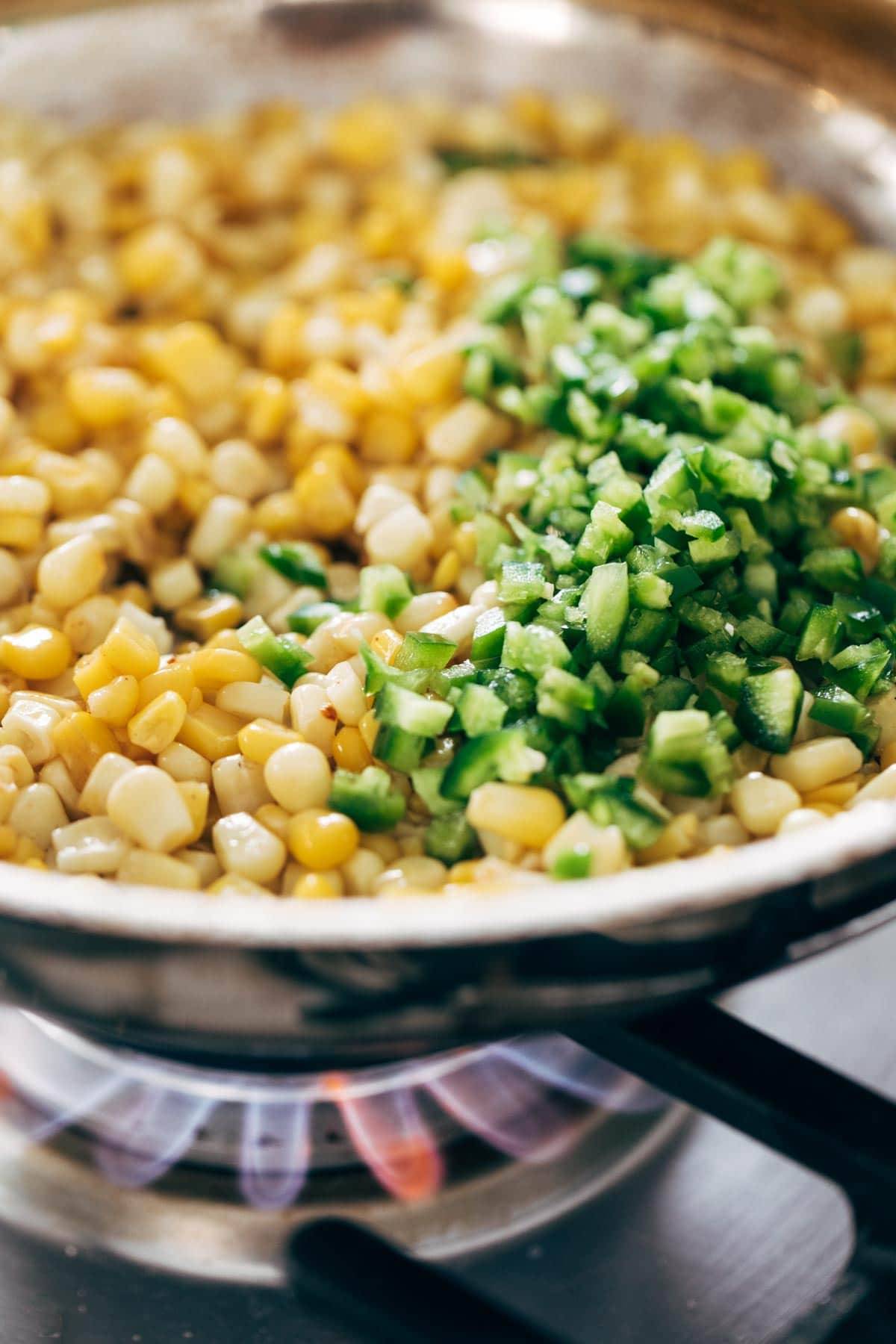 Corn and jalapeño in sauté pan.