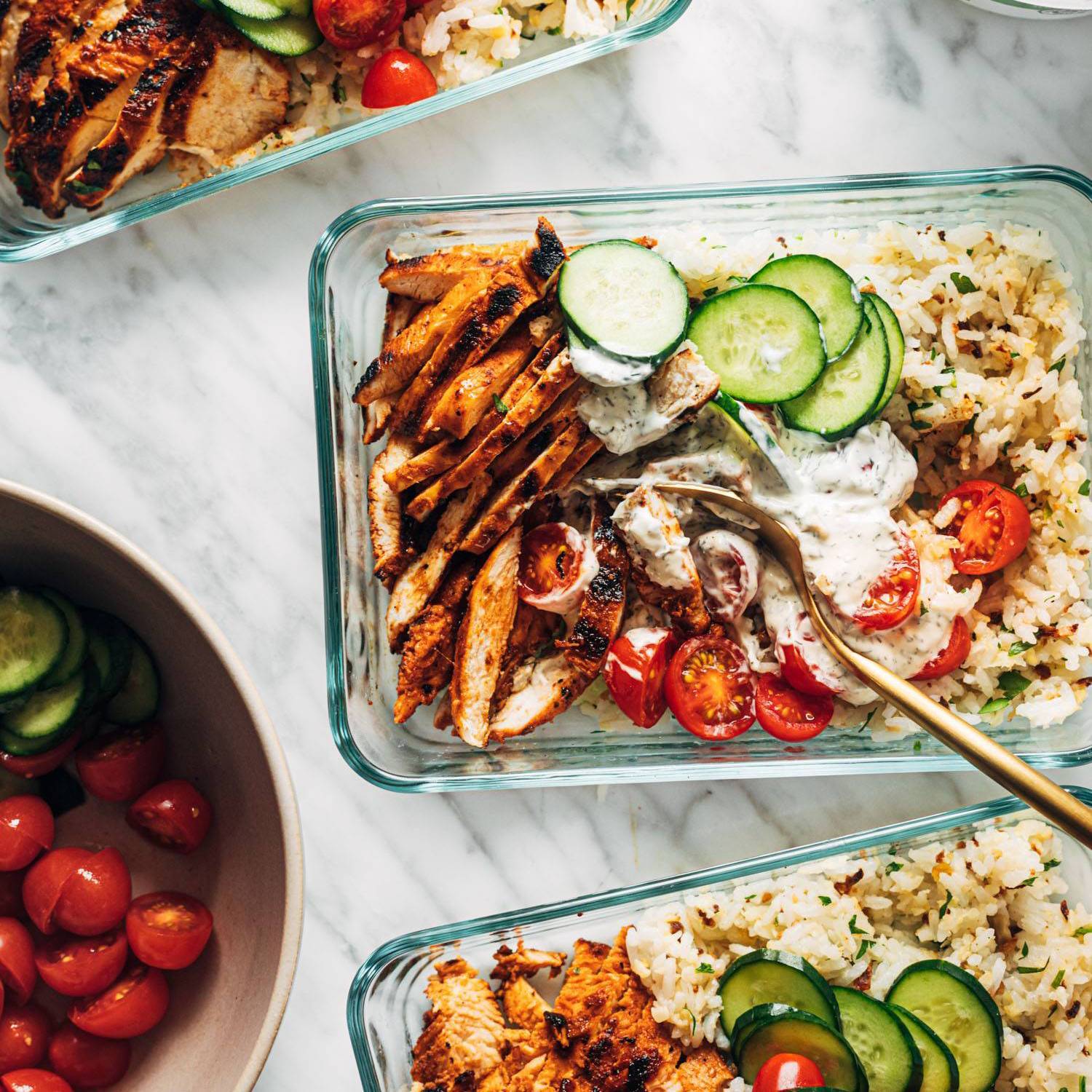 Buffalo chicken bowls in meal prep containers.