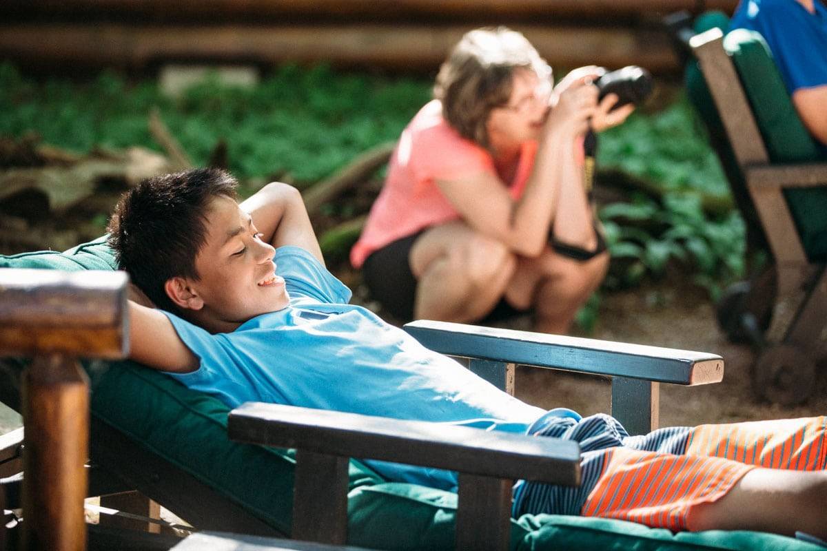 Boy relaxing in a chair.