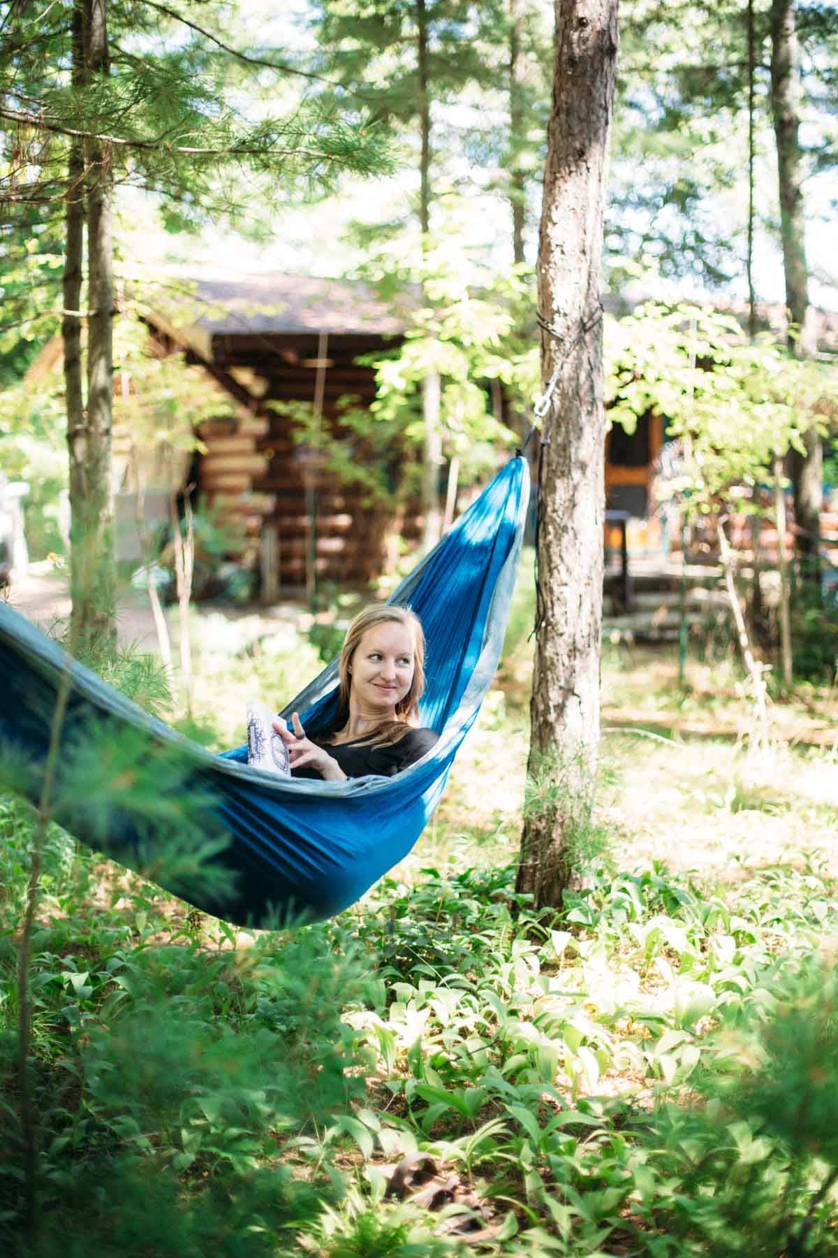 Girl swinging in a hammock.