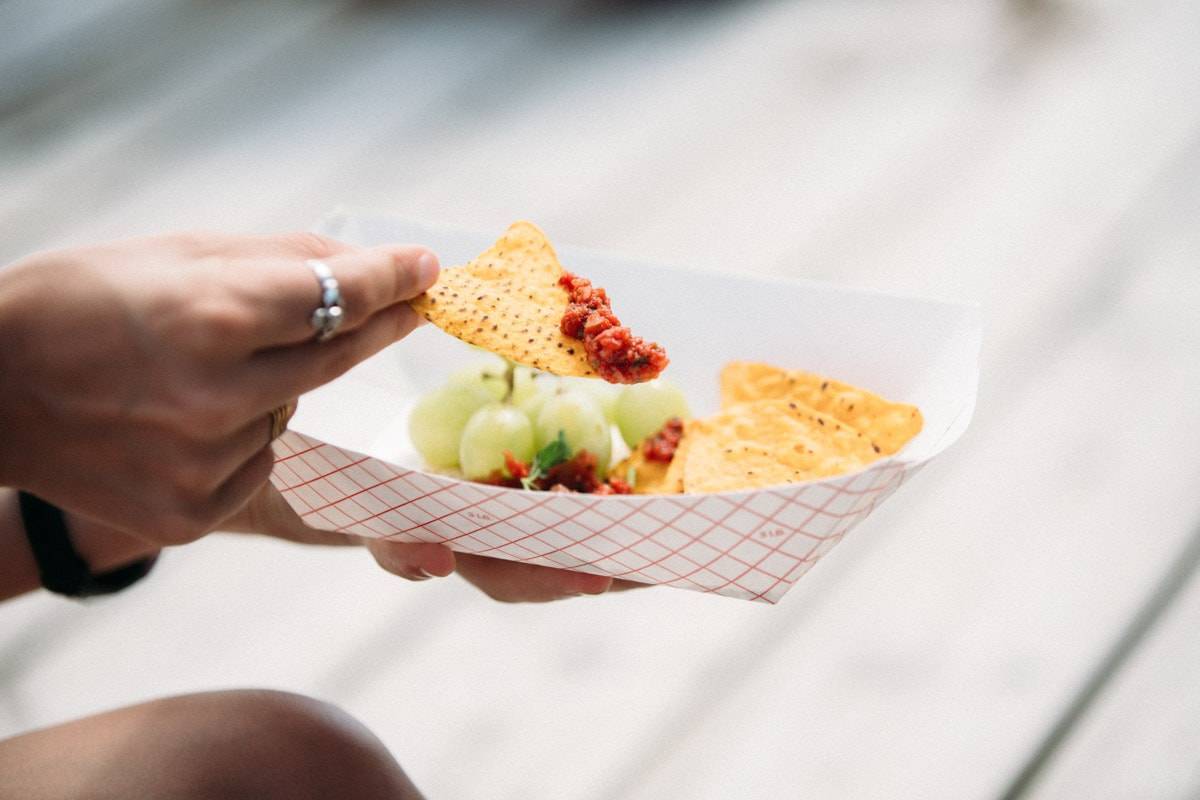 Chips with salsa and grapes.