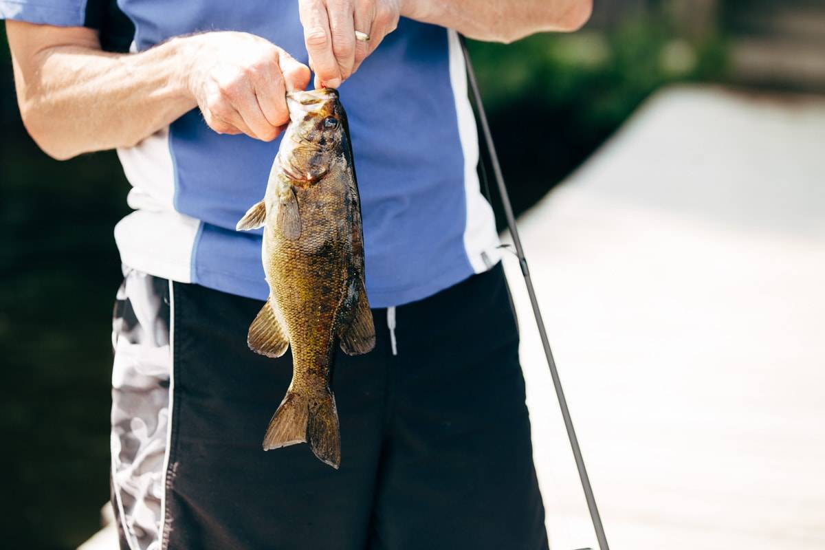 Man holding a fish.