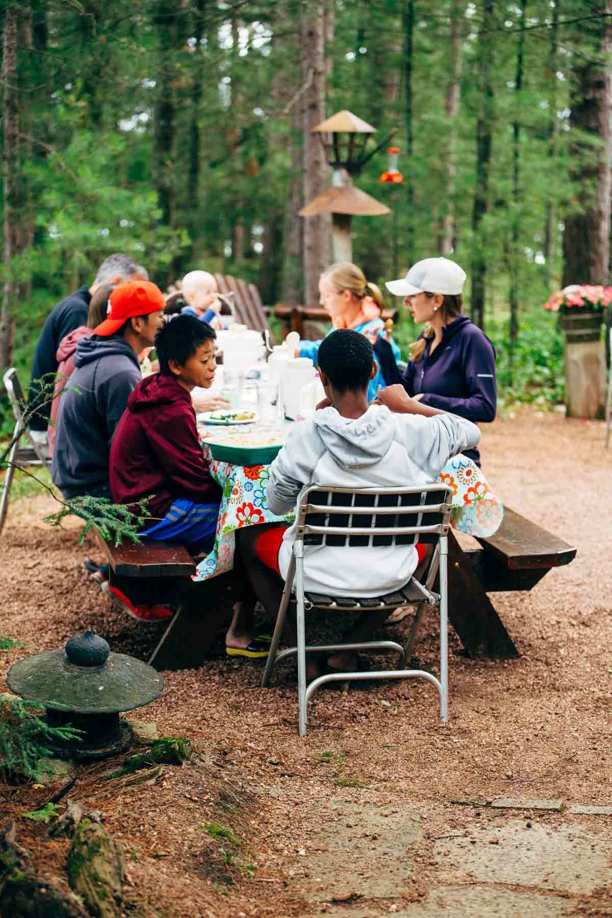 People sitting around a table eating.