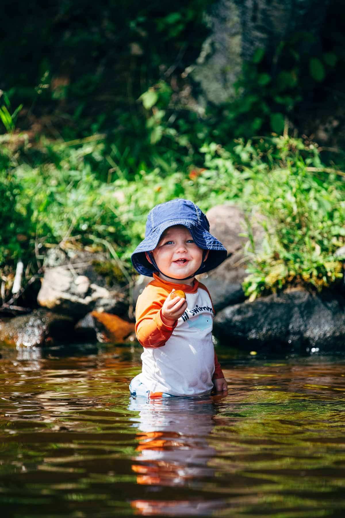 Toddler wearing a sun hat.