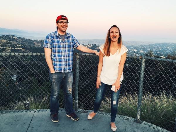 Man and woman smiling.