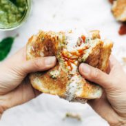 Caprese Grilled Cheese being pulled apart.