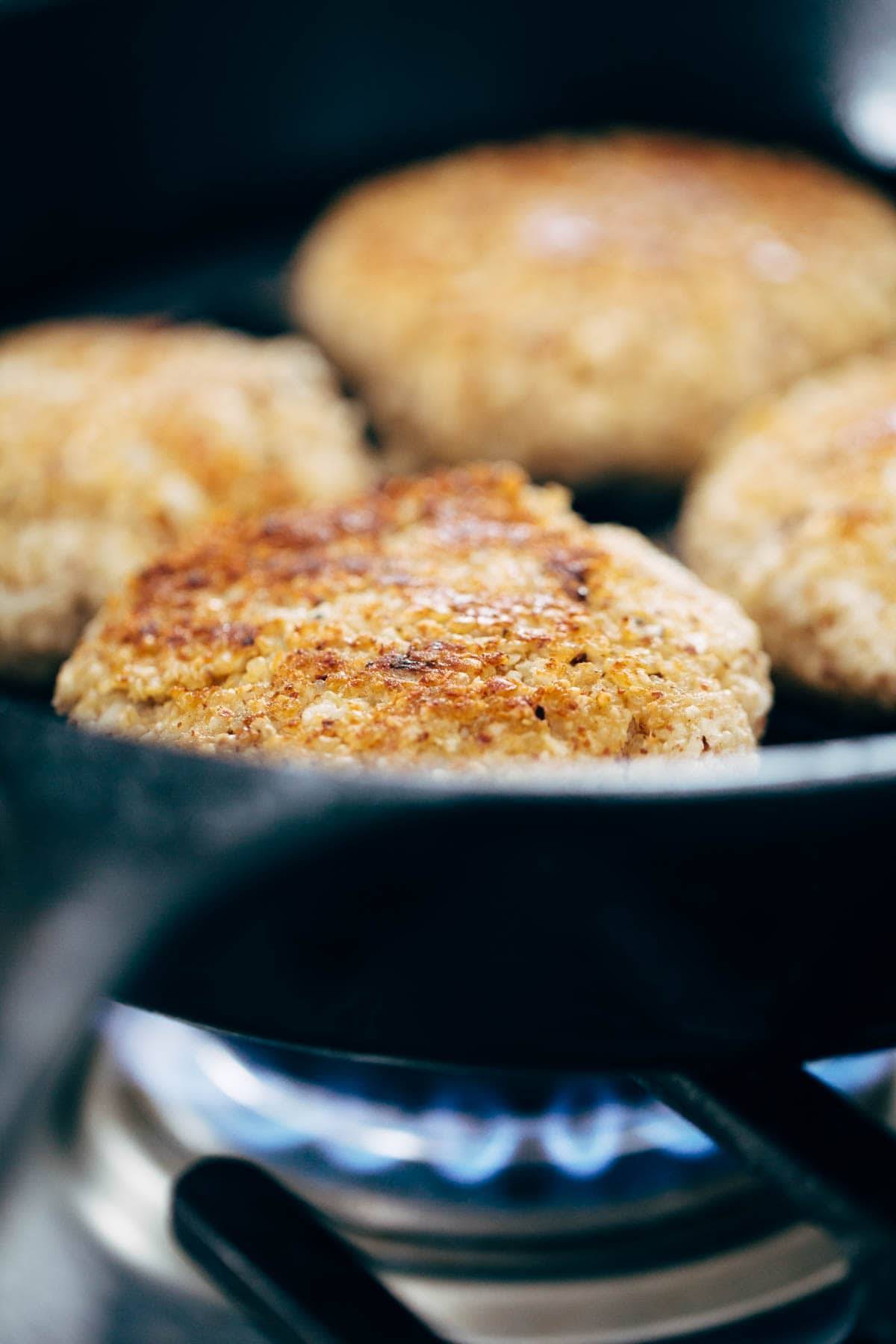 Recipe for Spicy Cauliflower Burgers with avocado sauce, cilantro lime slaw, and chipotle mayo! Meatless, filling, and delicious! | pinchofyum.com