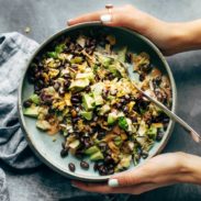 Cheater's Power Salad in bowl with hands.