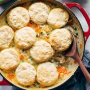 Chicken pot pie biscuits with gravy in a pan.