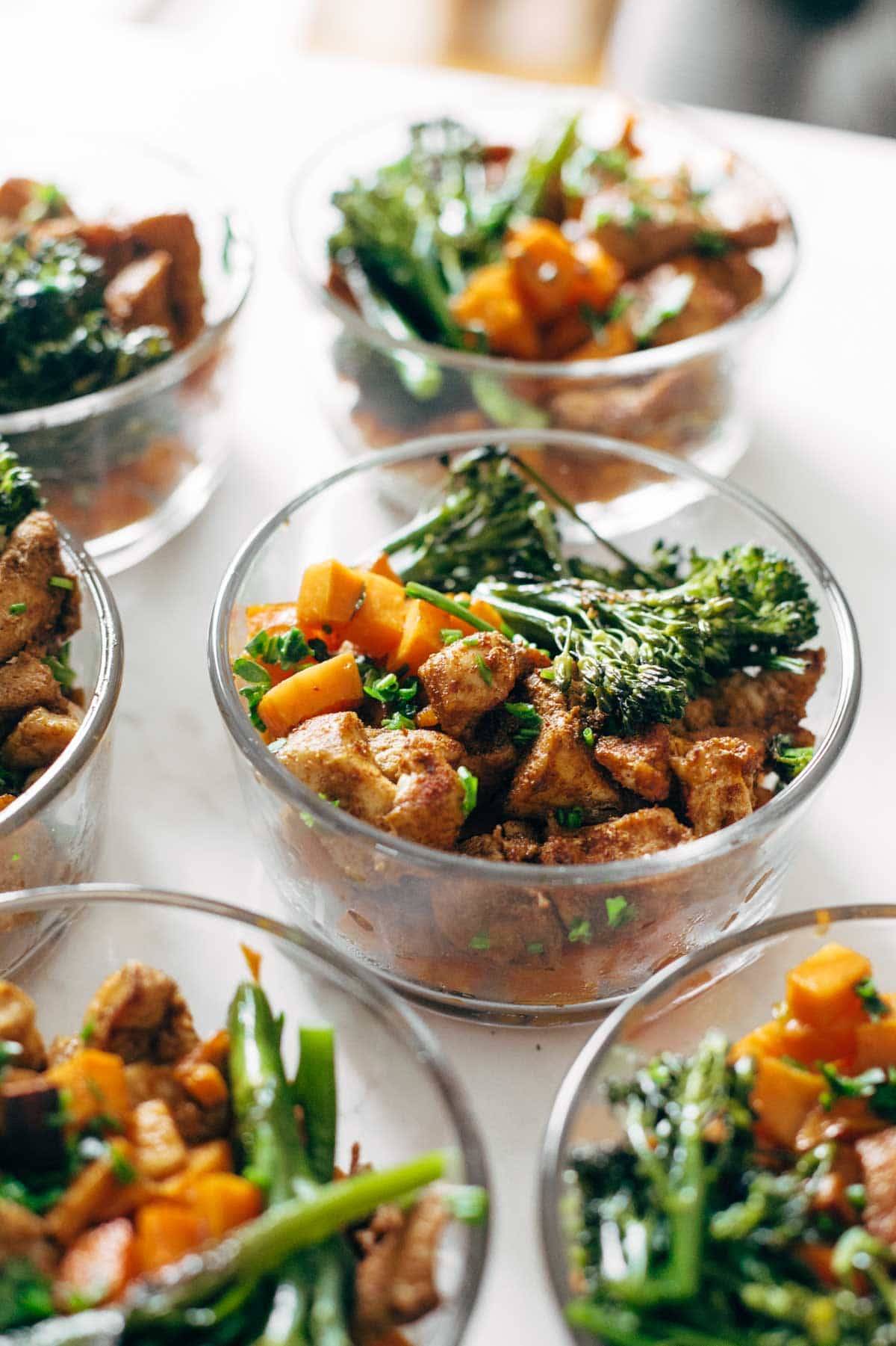 chicken and sweet potatoes in meal prep bowls