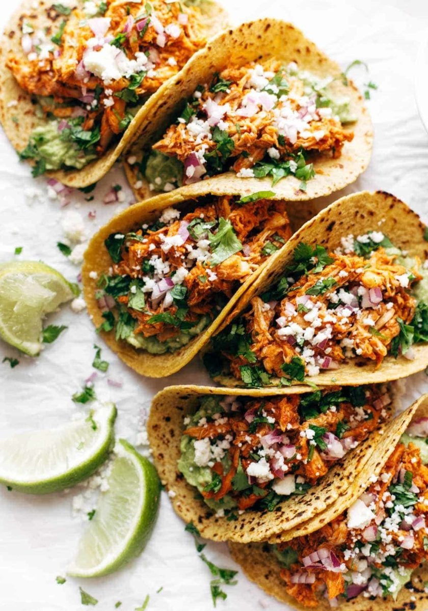 Chicken Tinga Tacos in a row.