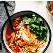 Chicken Tortilla Soup in a bowl with a spoon. There's a banner above that says "Chicken Tortilla Soup"