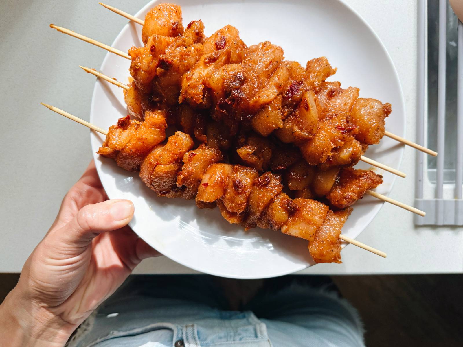 Chicken on skewers before cooking.