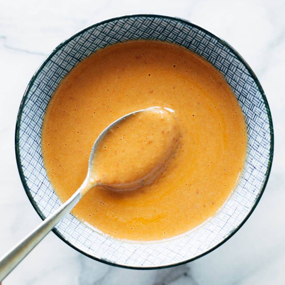 Chipotle tahini in a bowl with a spoon.