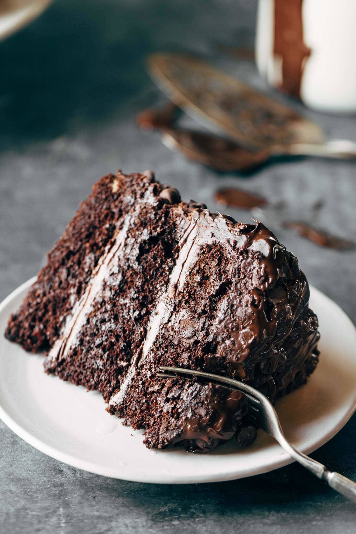 Piece of Blackout Chocolate Cake on a plate with a fork