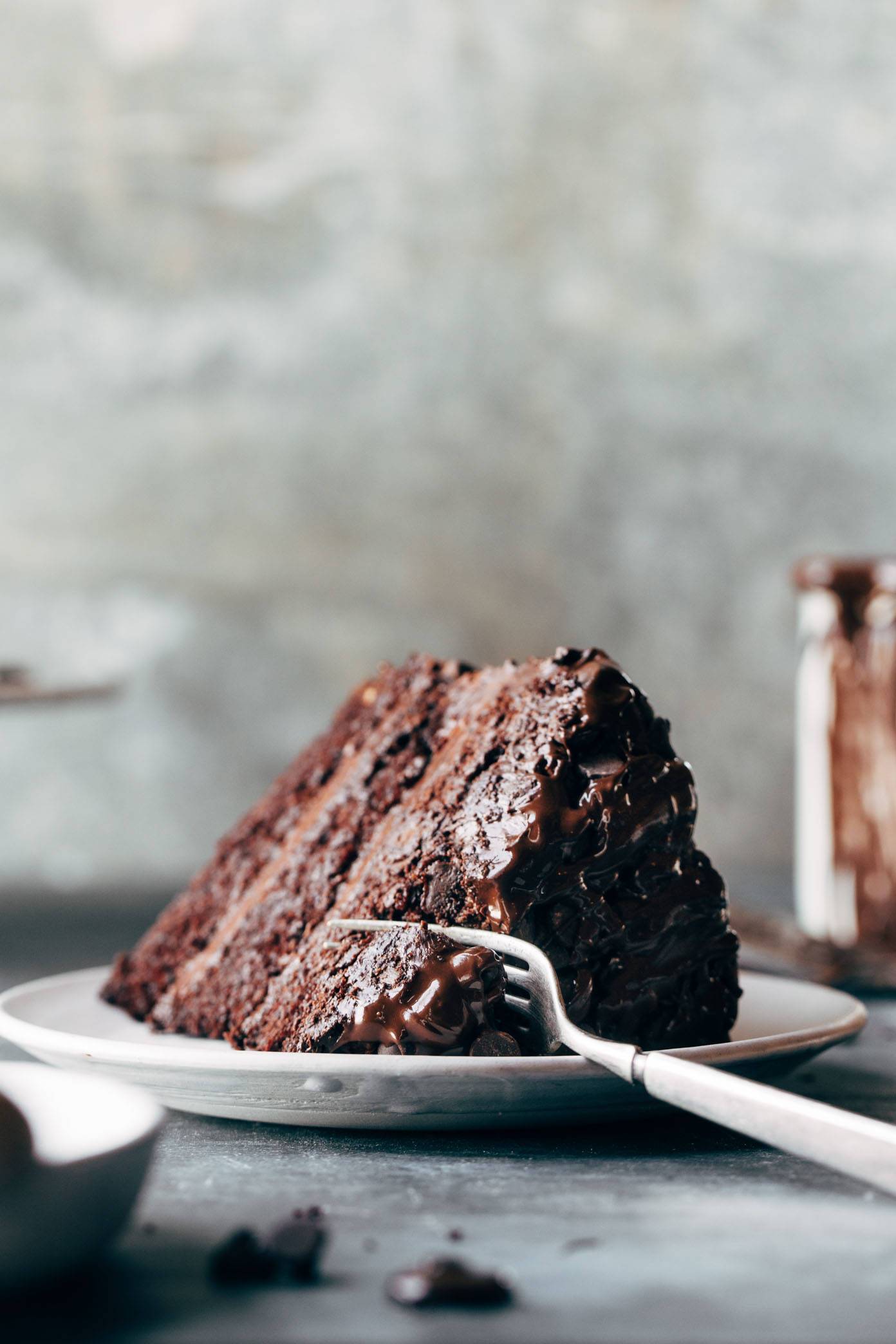 Slice of Blackout Chocolate Cake on a plate with a fork