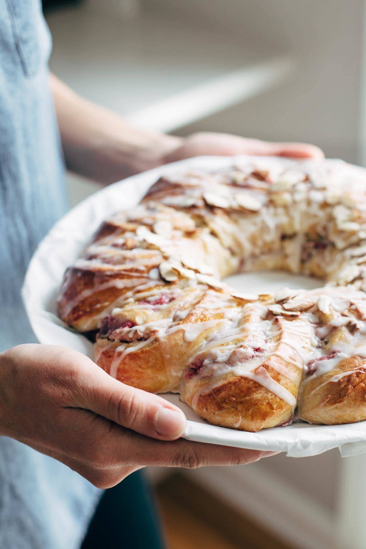 Christmas Tea Ring filled with Raspberry Cream Cheese Filling - the most beautiful Scandinavian-inspired recipe for holiday brunch! | pinchofyum.com