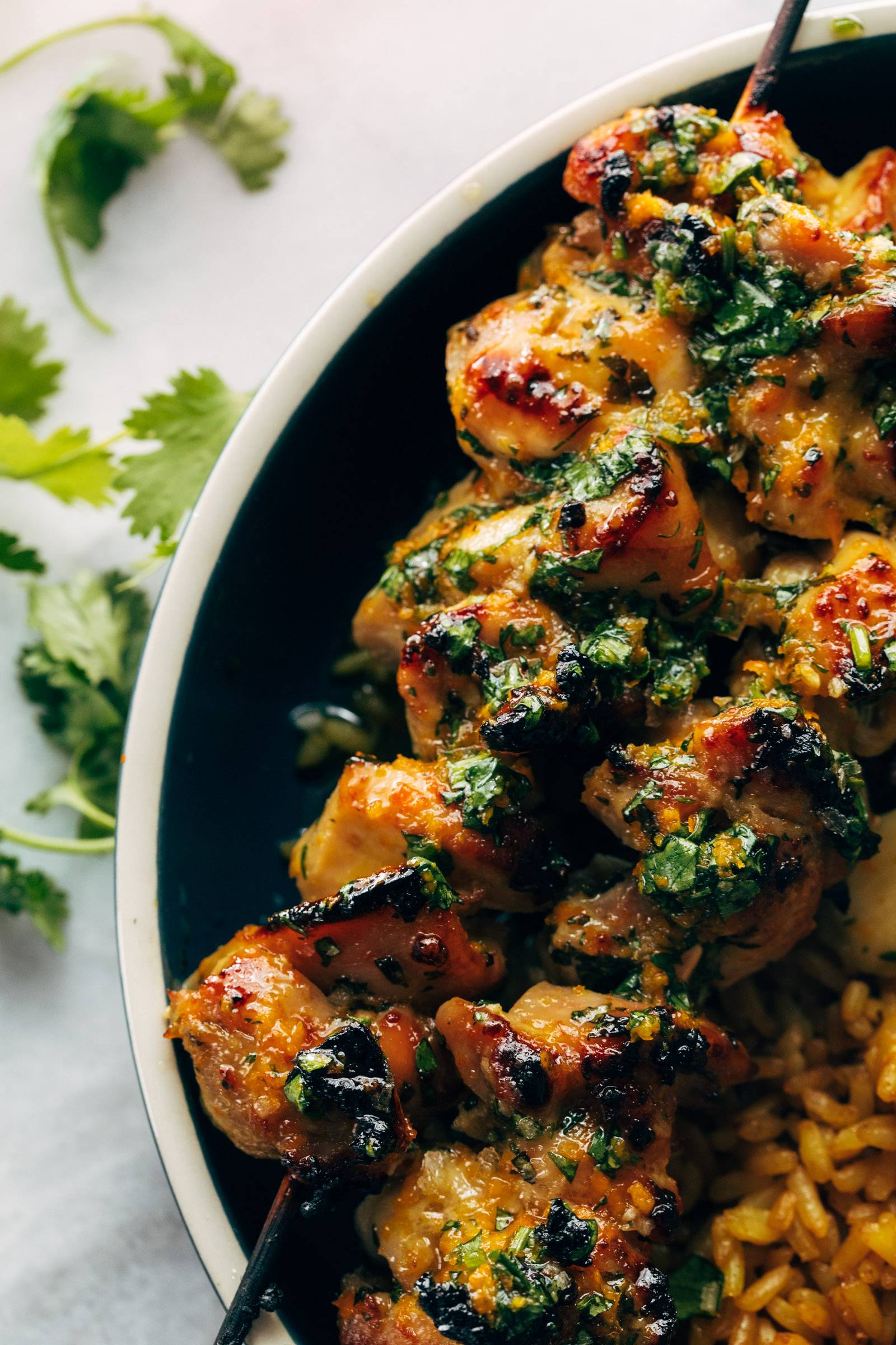 Chicken skewers in a bowl.