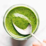 Cilantro Vinaigrette in a jar with a spoon.