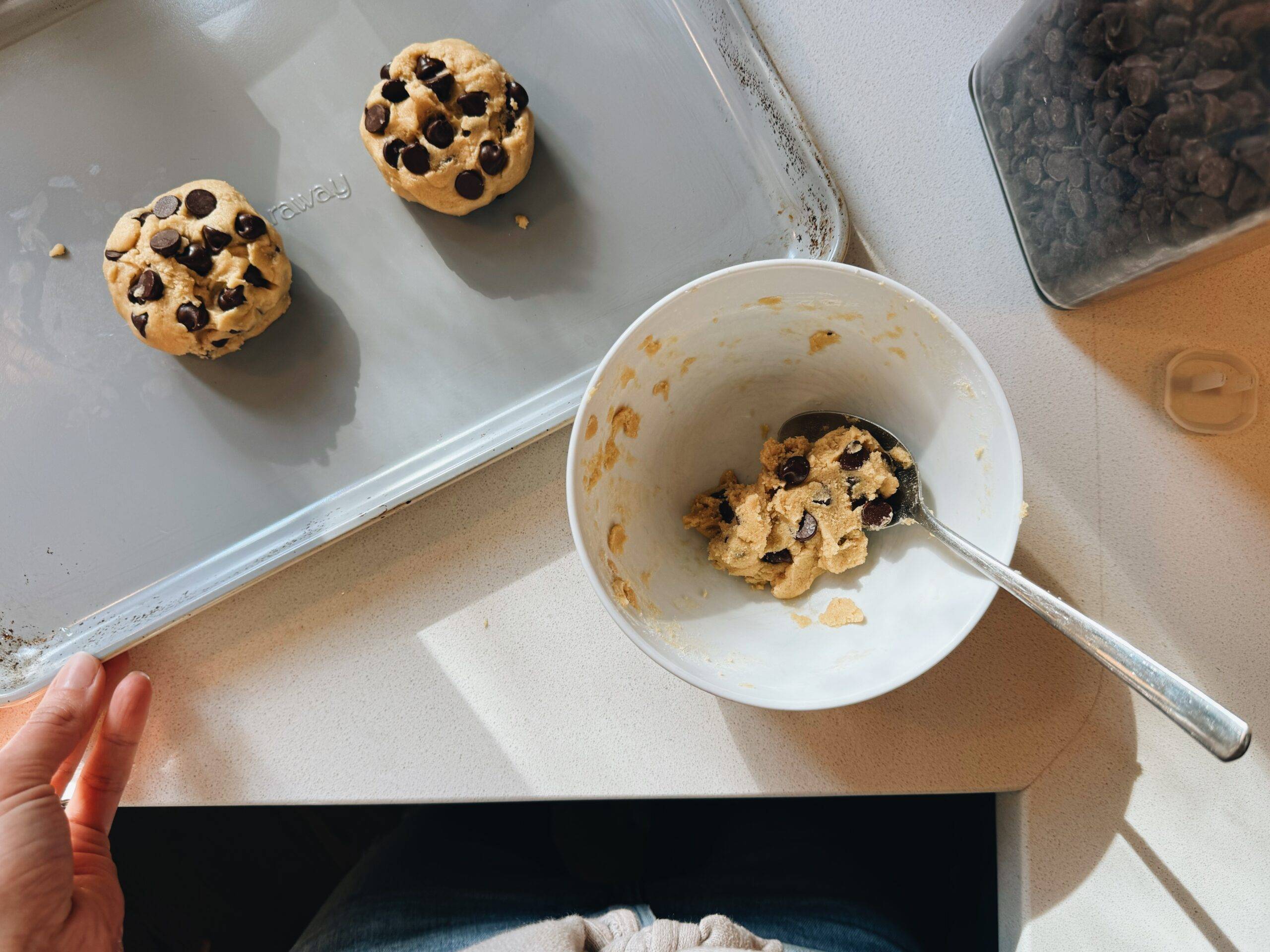 Cookie dough balls on a sheet pan.