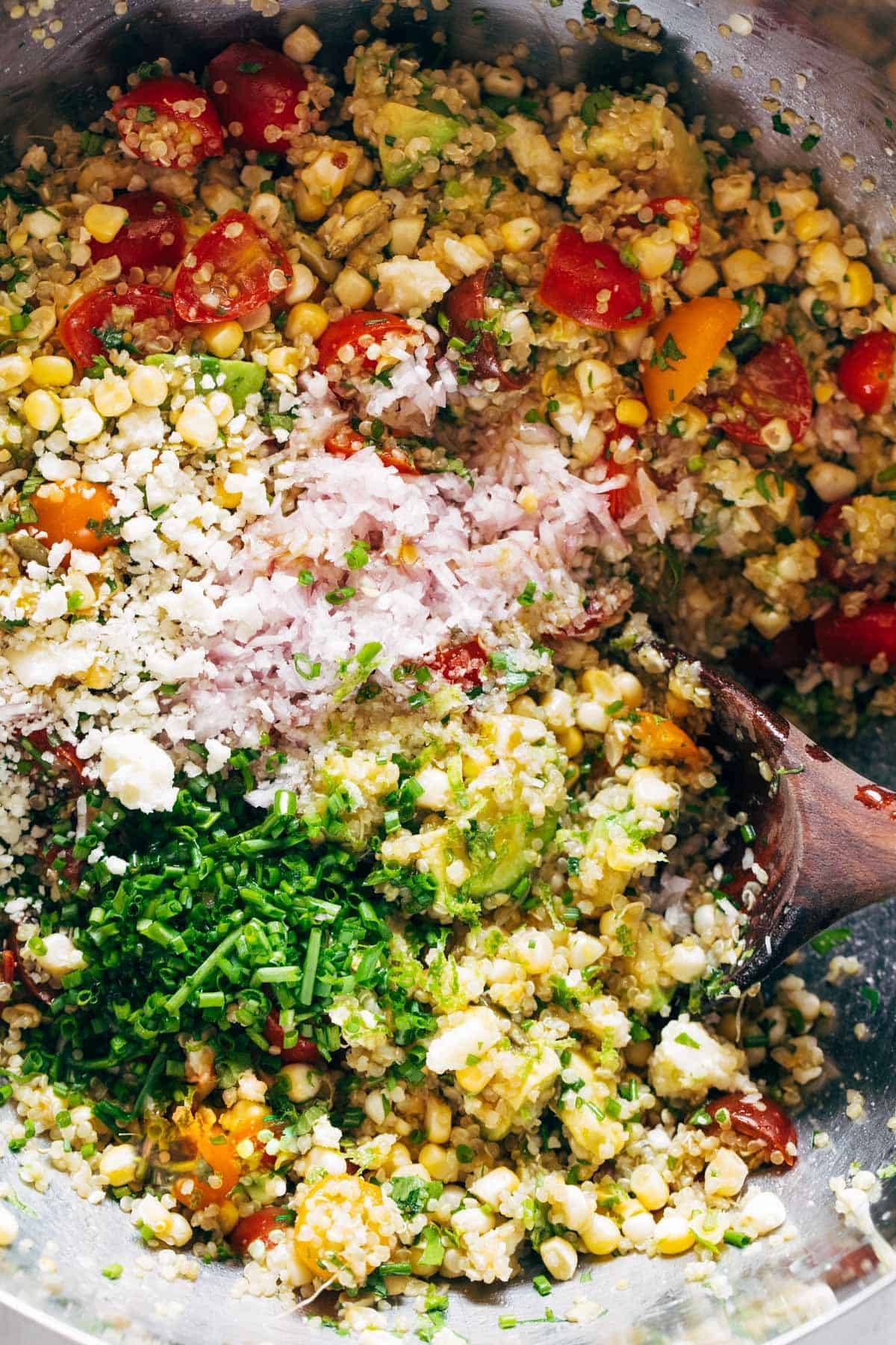 Ingredients for Corn, Avocado, and Quinoa Salad in a serving bowl.